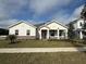 Charming single-story home showcasing a manicured lawn and stone accents at 2564 Hawks Overlook Pl, Oviedo, FL 32765