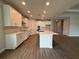 Spacious kitchen featuring an island, white cabinets, and stainless steel appliances at 2564 Hawks Overlook Pl, Oviedo, FL 32765