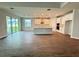 Bright kitchen offering an island, white cabinets, stainless appliances and wood floors at 2564 Hawks Overlook Pl, Oviedo, FL 32765