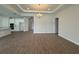 Open-plan living room and kitchen featuring wood-look flooring, and modern lighting at 2564 Hawks Overlook Pl, Oviedo, FL 32765