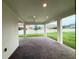 Covered brick patio and view of the spacious fenced backyard with well-manicured lawn at 2564 Hawks Overlook Pl, Oviedo, FL 32765