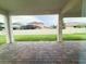 View of brick patio and spacious fenced backyard at 2564 Hawks Overlook Pl, Oviedo, FL 32765
