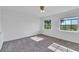 Sunny bedroom with large windows and soft carpet at 1322 Susannah Blvd, Orlando, FL 32803