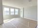 Bright living room with three large windows at 2619 Great Heron Ave, Saint Cloud, FL 34773