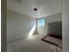 Unfinished bathroom with a stand-up shower and window with views of blue skies at 2655 Great Heron Ave, Saint Cloud, FL 34773