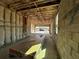 Garage under construction with exposed beams, insulation, and cinder block walls at 2684 Great Heron Ave, Saint Cloud, FL 34773