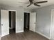 Bedroom showing doorway to bathroom, closet, and a ceiling fan at 3505 Pine Ridge Ct, Orlando, FL 32808