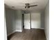 Bedroom featuring closet, ceiling fan, and doorway to another room at 3505 Pine Ridge Ct, Orlando, FL 32808