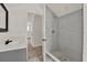 Stylishly renovated bathroom with a glass enclosed shower and modern fixtures at 500 N 13Th St, Leesburg, FL 34748