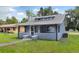 Charming bungalow-style home with a covered porch and freshly painted exterior at 500 N 13Th St, Leesburg, FL 34748