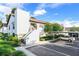 Two-story condo featuring a white exterior with a red tile roof and well-manicured landscaping at 740 #3 Killarney Bay Ct # 7-3, Winter Park, FL 32789