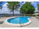 Community pool with waterfront views and plenty of lounge seating at 740 #3 Killarney Bay Ct # 7-3, Winter Park, FL 32789