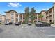 Apartment building showcasing its architecture, parking spaces, and landscaping at 907 Charo Pkwy # 923, Davenport, FL 33897