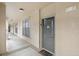 Hallway with apartment door and window view outside of the apartment at 907 Charo Pkwy # 923, Davenport, FL 33897