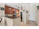 Kitchen featuring dark wood cabinets, stainless steel appliances, and tile backsplash at 907 Charo Pkwy # 923, Davenport, FL 33897