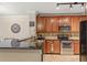 Kitchen with stainless steel appliances, dark countertops, and tile flooring at 907 Charo Pkwy # 923, Davenport, FL 33897