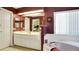 Bathroom with double vanity, soaking tub, and separate shower at 5825 Princess Caroline Pl, Leesburg, FL 34748