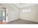 A bright bedroom with shutters and neutral carpet at 5825 Princess Caroline Pl, Leesburg, FL 34748