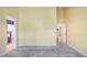 Bedroom with carpeting and a view of the en-suite bathroom at 5825 Princess Caroline Pl, Leesburg, FL 34748