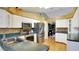 Updated kitchen with stainless steel appliances and dark countertops at 5825 Princess Caroline Pl, Leesburg, FL 34748