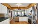 Bright kitchen with stainless steel appliances and ample cabinetry at 5825 Princess Caroline Pl, Leesburg, FL 34748