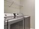 Laundry room with washer, dryer, and overhead shelving at 5825 Princess Caroline Pl, Leesburg, FL 34748