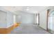 Bright living room with vaulted ceilings, a ceiling fan, and hardwood floors at 5825 Princess Caroline Pl, Leesburg, FL 34748