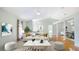 Bright living room with vaulted ceilings, an open floorplan, and hardwood floors at 5825 Princess Caroline Pl, Leesburg, FL 34748
