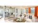 Staged sunroom with seating area and patio table; opens to dining area at 5825 Princess Caroline Pl, Leesburg, FL 34748