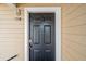 Close up of a black painted condo entry door with brass hardware and sidelight at 1013 South Hiawassee Road # 3627, Orlando, FL 32835