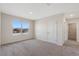 Bright bedroom with a window view and neutral carpet, enhancing the cozy atmosphere of this living space at 1608 Park Side Ave, Kissimmee, FL 34744