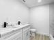 Modern double vanity bathroom with white cabinets at 1111 N Hart Blvd, Orlando, FL 32818