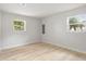 Spacious bedroom with neutral walls and wood-look floors at 1111 N Hart Blvd, Orlando, FL 32818