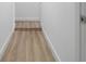 Light hallway with vinyl wood flooring at 1111 N Hart Blvd, Orlando, FL 32818