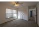 Cozy bedroom with natural light, ceiling fan, and neutral carpeting at 4423 Real Ct, Orlando, FL 32808