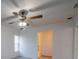 Carpeted bedroom featuring a ceiling fan and doorway to another room at 4423 Real Ct, Orlando, FL 32808