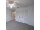 Bedroom featuring neutral carpet, a ceiling fan, and a large closet at 4423 Real Ct, Orlando, FL 32808