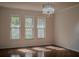 Bright dining room with hardwood floors and large windows at 4423 Real Ct, Orlando, FL 32808