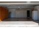 Garage with overhead door, storage, and refrigerator at 4423 Real Ct, Orlando, FL 32808