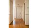 Clean and bright hallway with wood flooring at 4423 Real Ct, Orlando, FL 32808