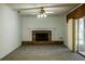 Living room featuring a brick fireplace and gray carpeting at 4423 Real Ct, Orlando, FL 32808