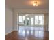 Bright living room featuring hardwood floors and an opening to the sunroom at 4423 Real Ct, Orlando, FL 32808