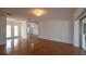 Bright living room with hardwood floors leading to the front entry and other living spaces at 4423 Real Ct, Orlando, FL 32808