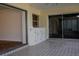 Sunroom with tiled floor, sliding doors and built-in cabinets at 4423 Real Ct, Orlando, FL 32808