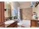 Clean bathroom with shower/tub combo and granite vanity at 906 Charo Pkwy # 433, Davenport, FL 33897