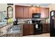 Well-equipped kitchen featuring stainless steel appliances and ample cabinetry at 906 Charo Pkwy # 433, Davenport, FL 33897