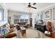 Relaxing living room with leather sofa and ceiling fan at 906 Charo Pkwy # 433, Davenport, FL 33897