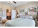 Spacious bedroom with a comfortable bed and ensuite bathroom at 906 Charo Pkwy # 433, Davenport, FL 33897