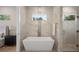 A luxurious bathroom featuring a soaking tub and modern fixtures at 1020 W Princeton St, Orlando, FL 32804