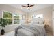 Comfortable bedroom with large windows, neutral decor, and a cozy bed with a bench at 1020 W Princeton St, Orlando, FL 32804